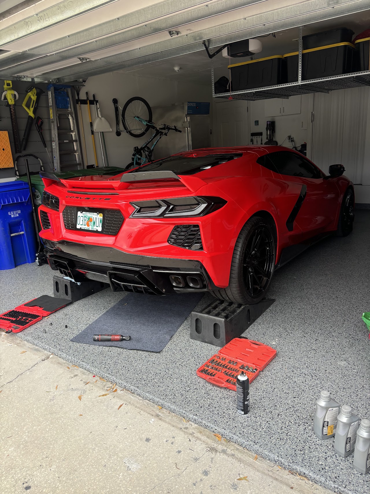Clean modern auto repair shop with car on lift