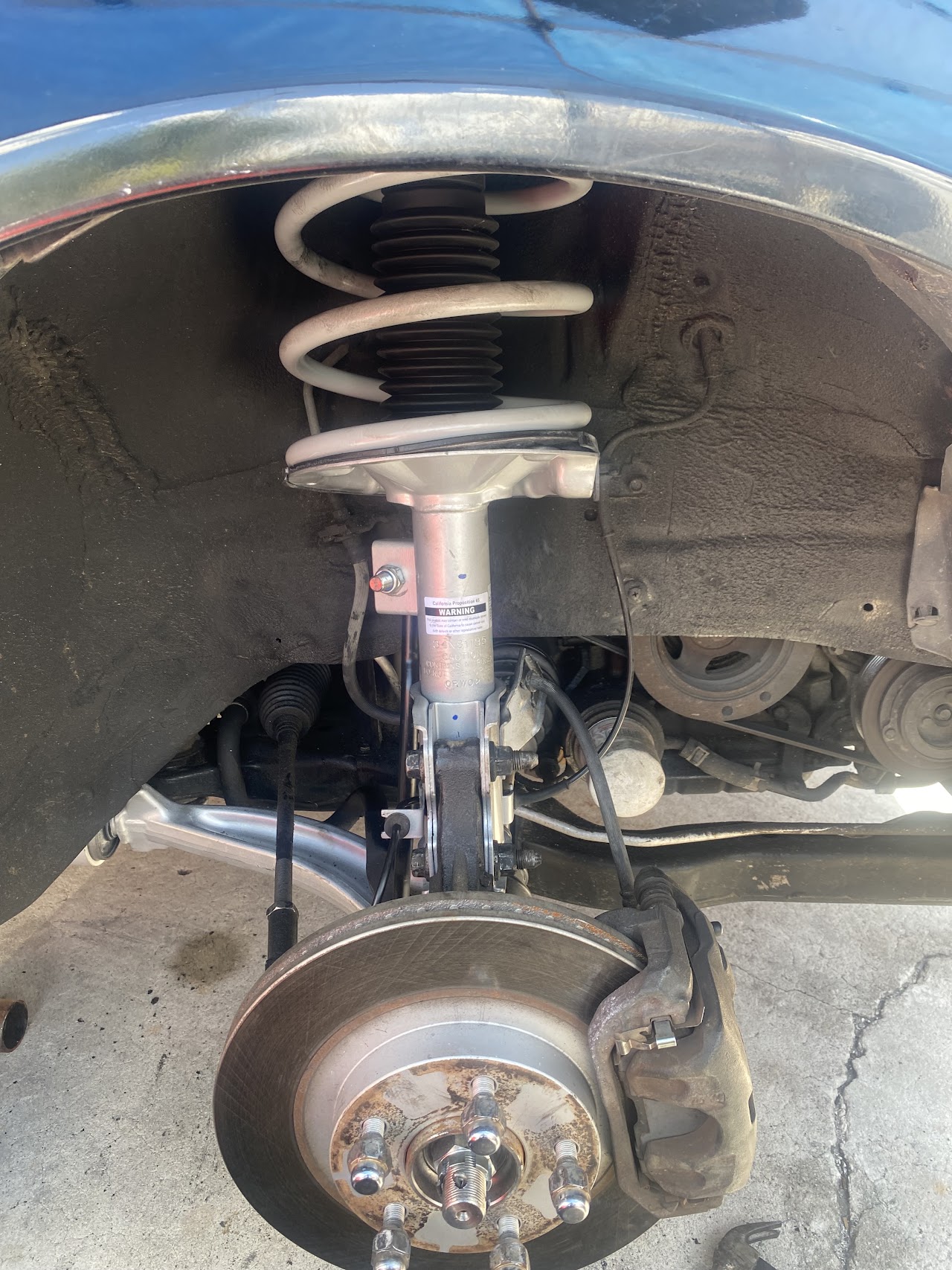 Technician performing oil change